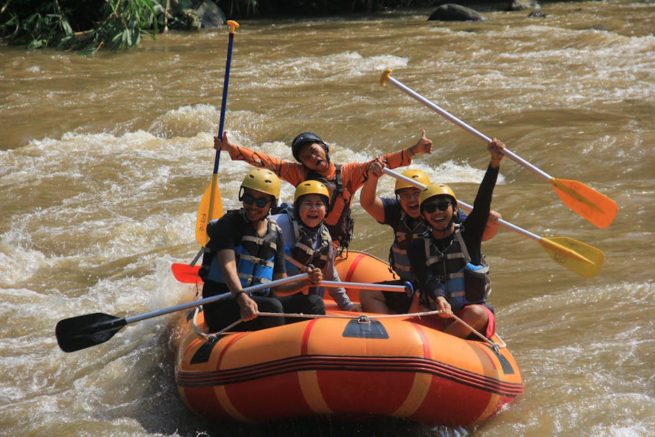 whitewater rafting trip - Joyful group rafting in Yogyakarta, Indonesia, experiencing thrilling river rapids.